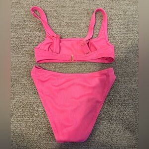 This is a bright pink swimsuits. Never been worn